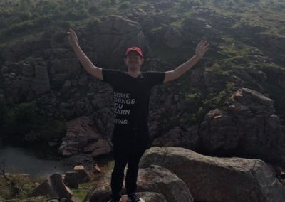 Man standing on rocks in the Wichita Mountains Wildlife Refuge